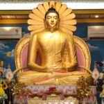 A serene view of the Buddha statue inside the temple, radiating peace and tranquility