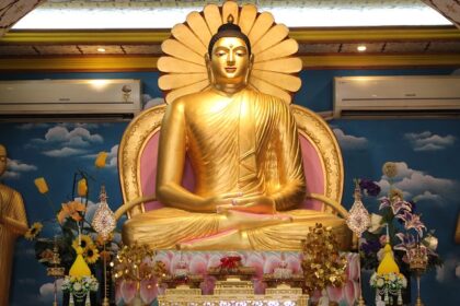 A serene view of the Buddha statue inside the temple, radiating peace and tranquility