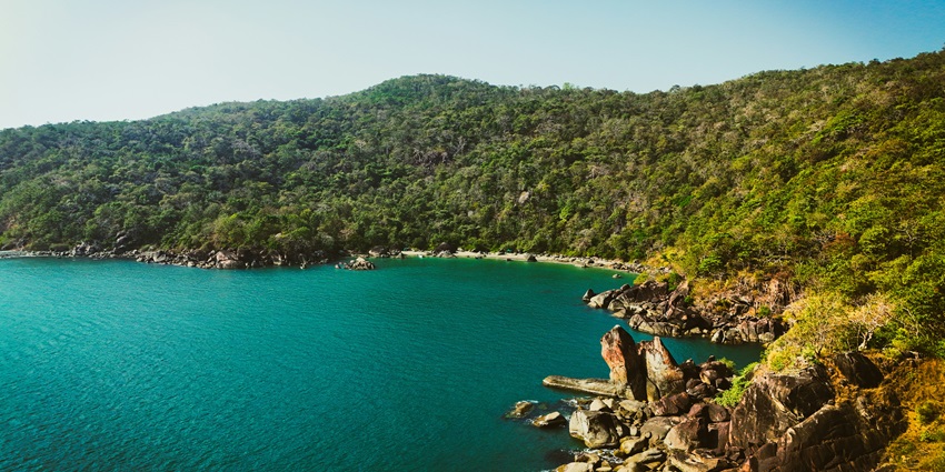 Secluded Butterfly Beach with its serene surroundings, ideal for couples seeking privacy.