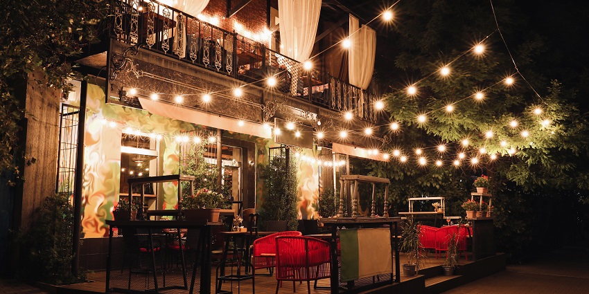 Cosy environment at the outer setting the Cafe Mambo, with warm fairy lights and cute chairs