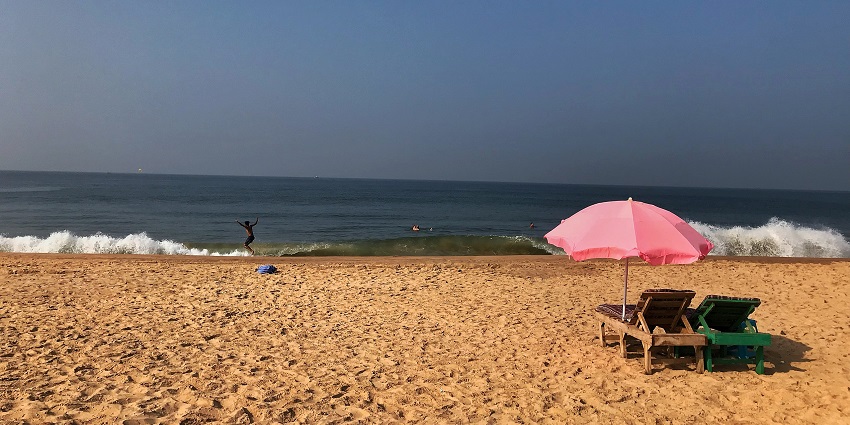 Panoramic views of the Calangute Beach and the waves of the cold Arabina sea on the shores of Goa
