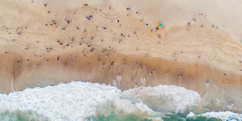 An aerial view of the shimmering waters meeting the golden sands at Calangute Beach.
