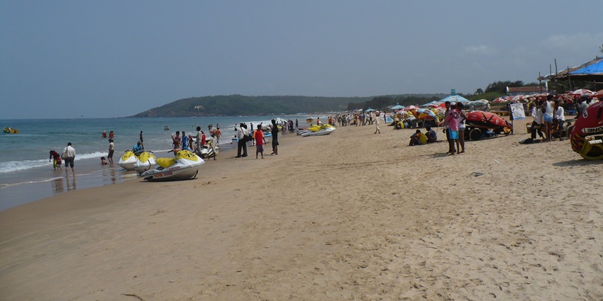 Golden sands and palm trees lining the lively shore of Calangute Beach-places to visit in goa for couples