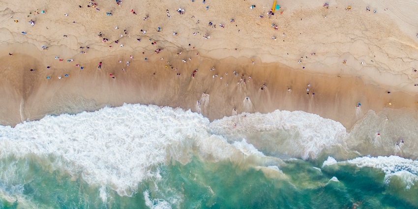 An image of people enjoying at Calangute Beach which is one of the famous tourist places.