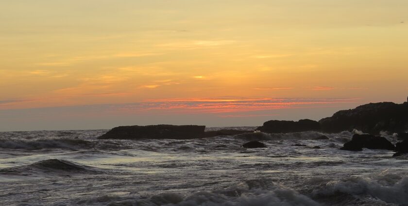 A beautiful sunset over Calangute Beach, with vibrant colors reflecting on the water.