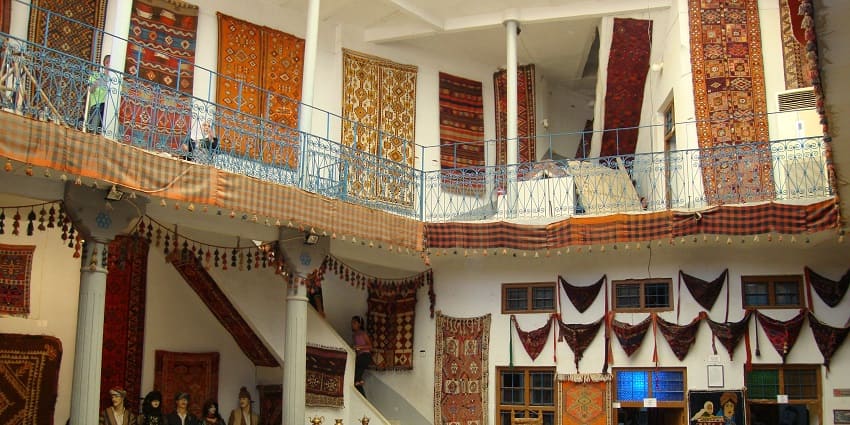 Crowd of visitors exploring the Calico Museum of textiles, one of the best museums in Ahmedabad