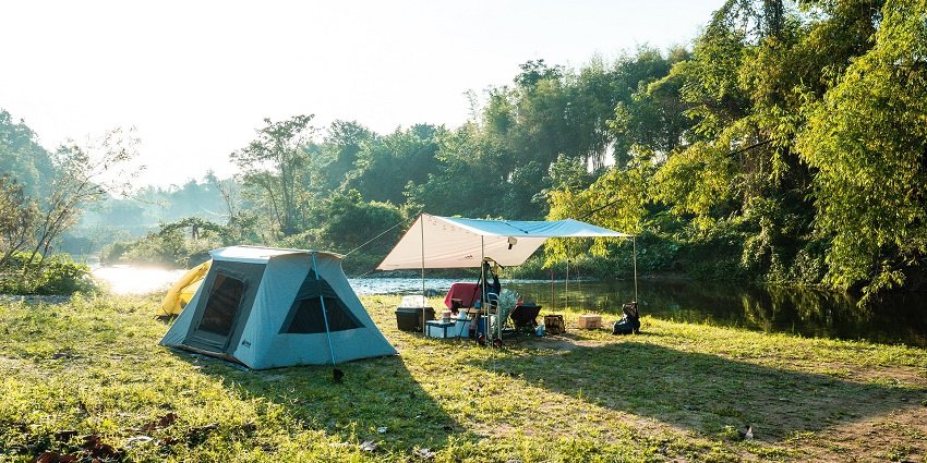 Beautiful image of the camp side and the majestic lush forest and lake around it