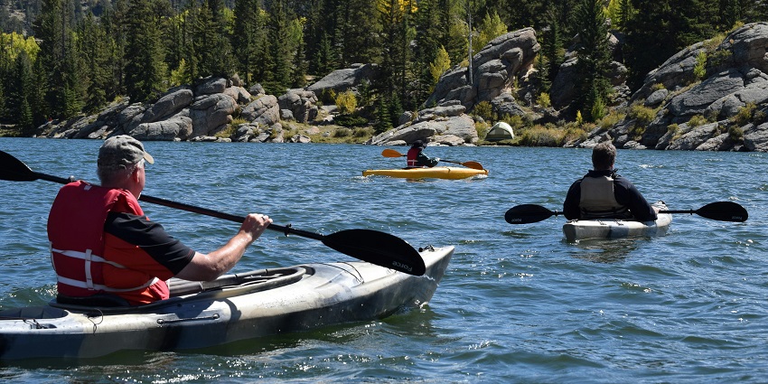 Adventurers experiencing one of the best adventure sports in Nepal which is canoeing.