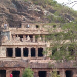 An amazing view of a historical structure in Andhra Pradesh with people all around it.