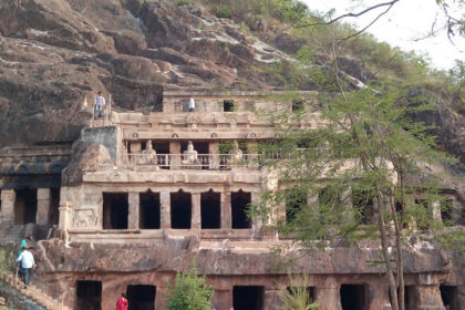 An amazing view of a historical structure in Andhra Pradesh with people all around it.