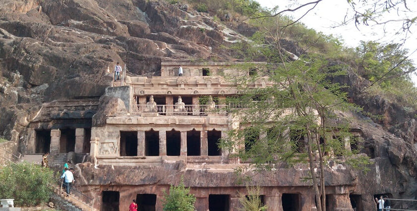 An amazing view of a historical structure in Andhra Pradesh with people all around it.