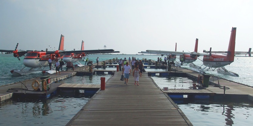 Aerial view of the Sea Plane Terminal in Malé, Maldives, showcasing several Twin Otter seaplanes