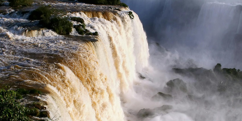 An image of Chachai Falls tumbling from a height, framed by rugged cliffs