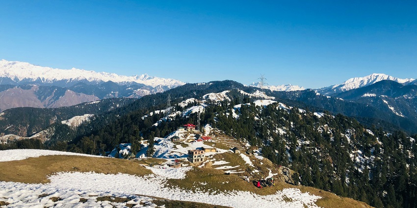 Beautiful view of Chamba and mountains with twisty road and a house on the side