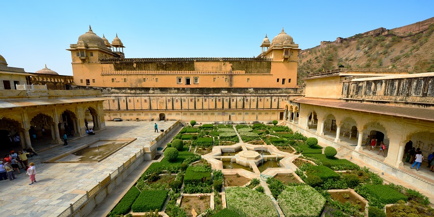 Majestic view of the garden with a fort in the background