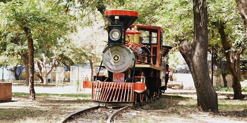 A close-up view of the Chambal Express train featuring its red and yellow carriages.