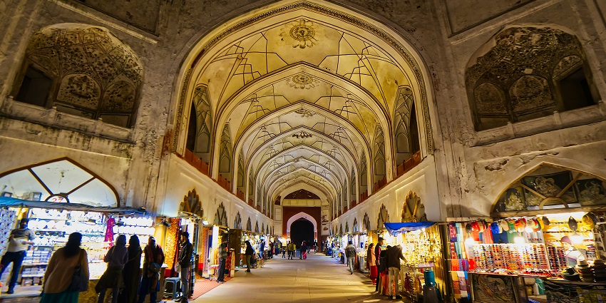Shop for unique souvenirs and traditional clothing at the vibrant Chandni Chowk.