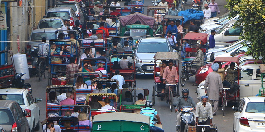 An aerial picture of the bustling streets of Chandni Chowk jam-packed with vehicles and pedestrains