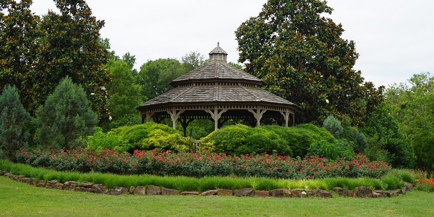 Beautiful image of a majestic gardens amidst the green lush trees around it.
