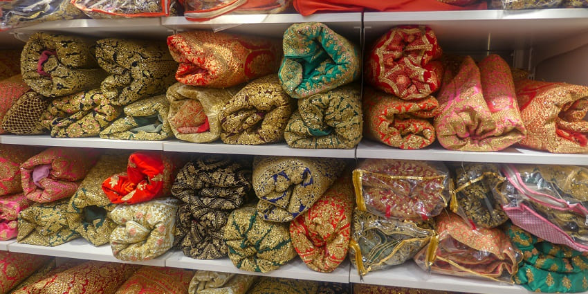 Chandpole Bazaar offers vibrant Rajasthani bridal attire, lehengas, and sarees.
