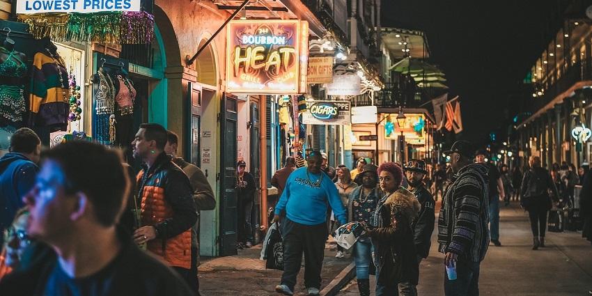 Night street market bustling with people and vibrant stalls, showcasing crowded scenes.