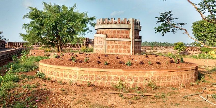 A view of the Chandragiri tourist attraction in the region featuring a water tank.