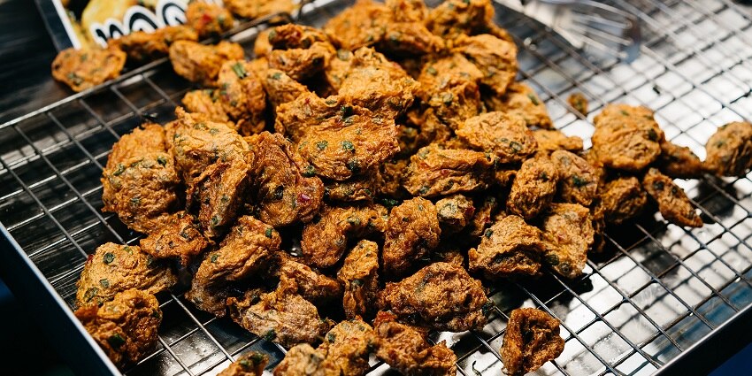 This food market offering assorted meats is the best place to enjoy Chiang Mai nightlife.