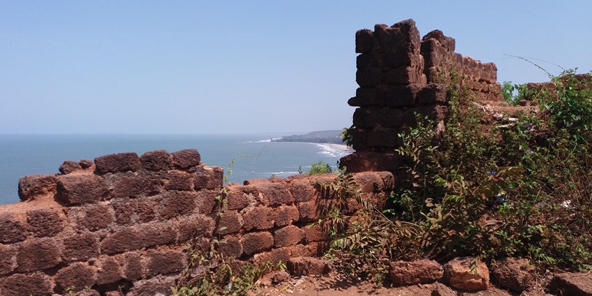 A glimpse of the ruins of the iconic Chapora Fort in the area made of red sandstone.