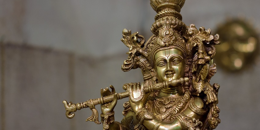 Exquisite carved idol of Lord Krishna, showcasing divine artistry at Charbhuja Temple.