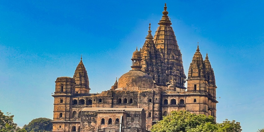 Chaturbhuj Temple features its prominent central spire, detailed stone carvings, and the temple's grandeur
