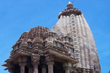 Chaturbhuj Temple with detailed stone carvings and a tall spire showcasing ancient architecture.