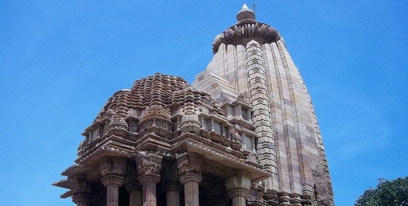 Chaturbhuj Temple with detailed stone carvings and a tall spire showcasing ancient architecture.