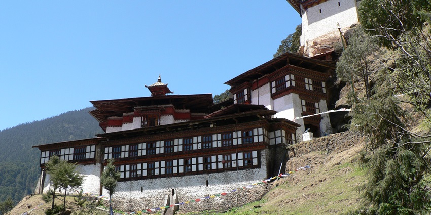 Cheri Monastery perched on forested hillside above Thimphu Valley in misty light—bhutan picnic places