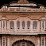 Wide angle view of the Chhachhrauli fort through an archway, showcasing the intricate architecture