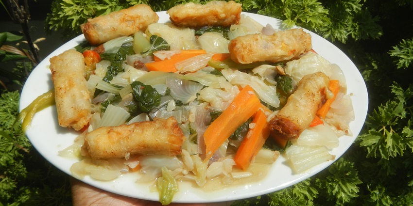 Chicken roll served with sauted mixed vegetables, offering an explosion of flavours