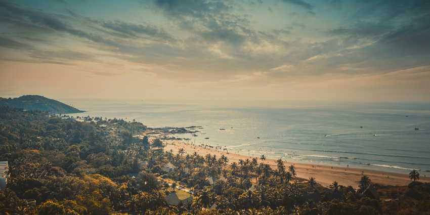 Chill at the serene Anjuna Beach which is one of the things to do in Goa, India.
