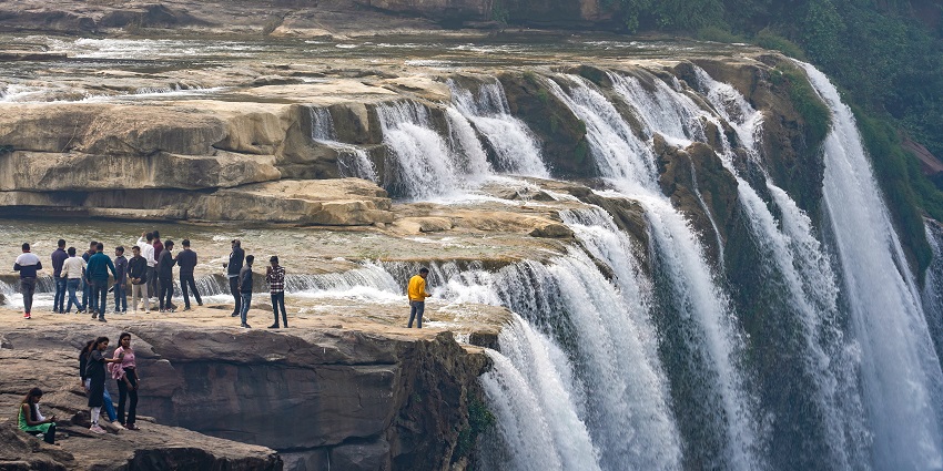 An amazing view of tourists enjoying at the top of the Keoti Falls, one of the best thing to do in Rewa.