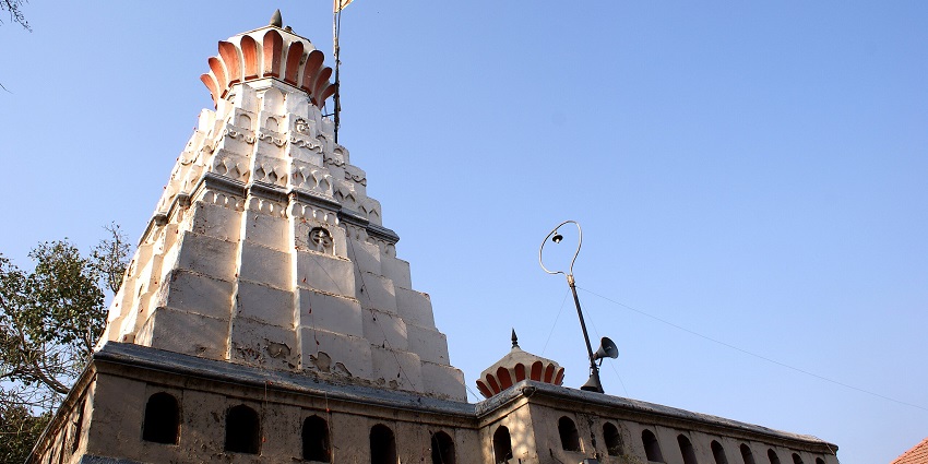Tranquil Ashtavinayak temple features beautiful architecture and lively festivals.