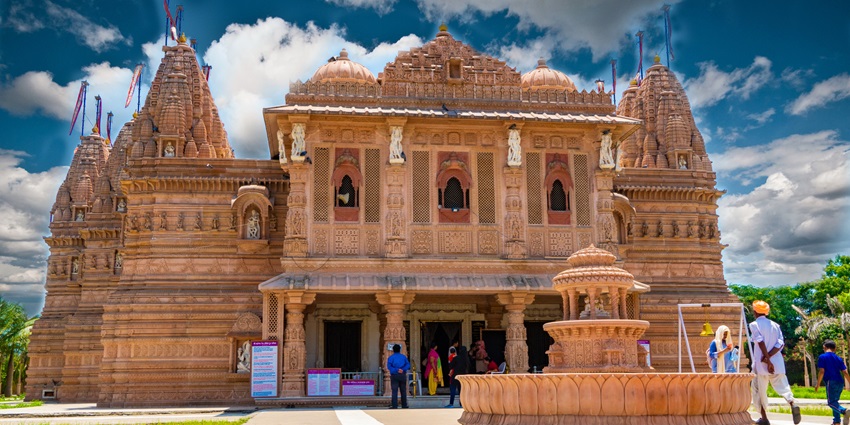A frontal view of a historical temple in Barmer with intricate carvings on its walls