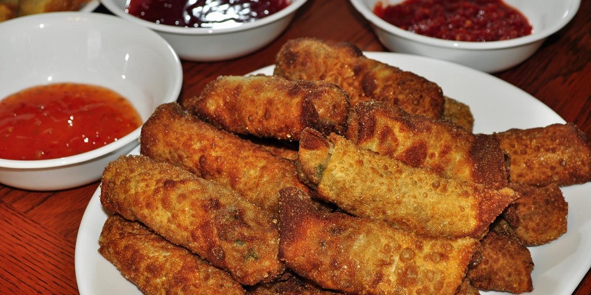 Egg rolls served with spicy chutney and ketchup, one of the most preferred dishes for spicy lovers