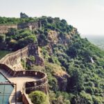 A wide-angle view of the historic city of Chittorgarh, featuring the expansive meadows.