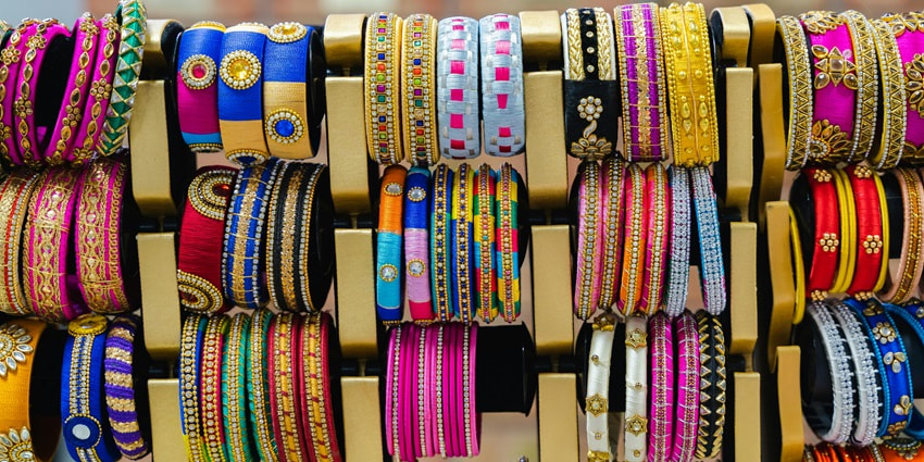 A display of colourful bangles on a rack in various sizes and patterns in the city of Alwar