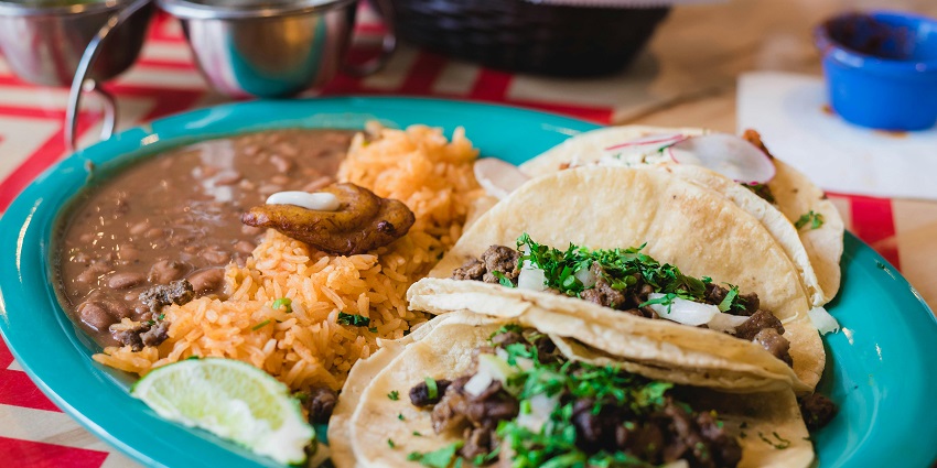 Barbecue and Indian dishes with outdoor seating, vibrant dining experience