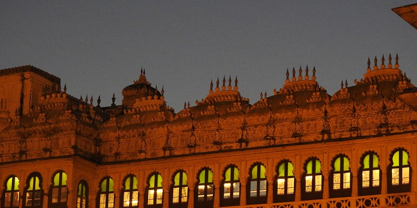 Exterior view of the City Palace showcasing its grand architecture, a famous thing to see in Udaipur at night
