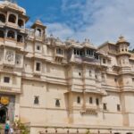 Majestic front view of the City Palace Museum, Udaipur showcasing grand architecture.