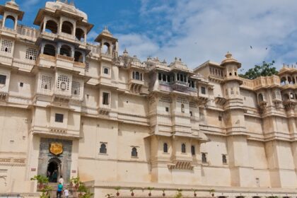 Majestic front view of the City Palace Museum, Udaipur showcasing grand architecture.