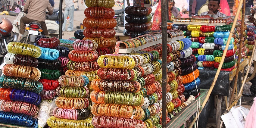 View of the bustling Sardar Market in Jodhpur, showcasing narrow shops and vendors.