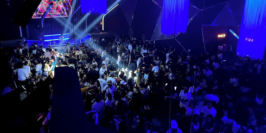 Top view of the crowd in the club dancing and partying, a must have experience in nightlife in north goa