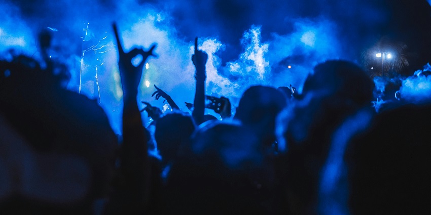 A view of people grooving to the beats and surrounded by bright lights at Club Cubana.