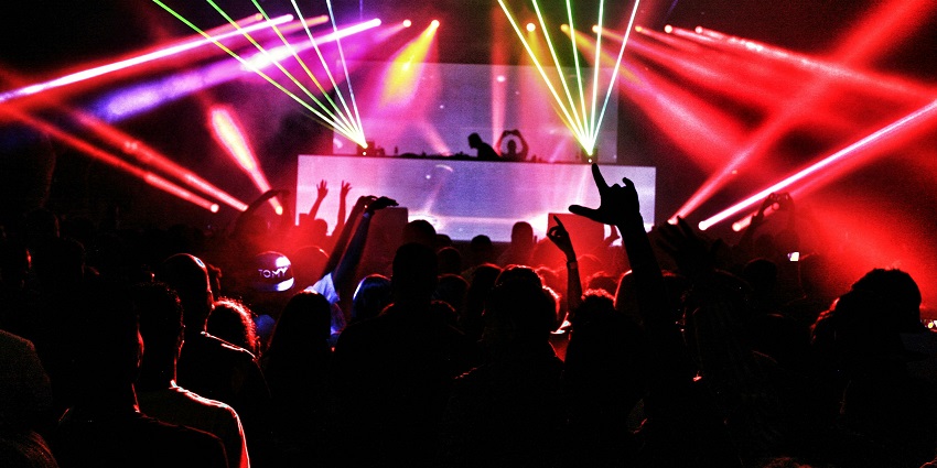 A glimpse of the Club Fahrenheit featuring colourful neon lights and a lively ambience.